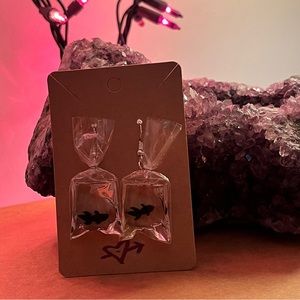 Black fish in bag earrings